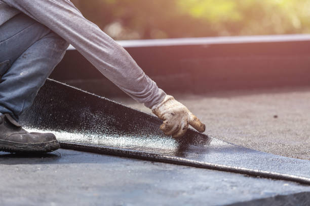 Professional Basement Waterproofing technician working in Graysville, AL